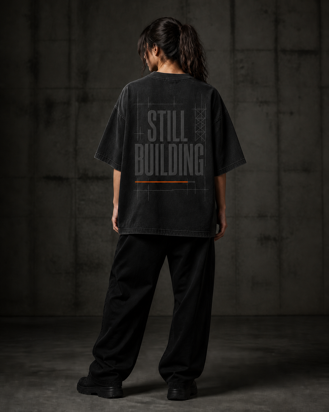 Back view of UNFINAL STILL BUILDING oversized black tee